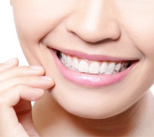 Close-up of a smiling person with white, healthy teeth.