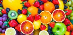 A vibrant assortment of fresh citrus fruits and berries.